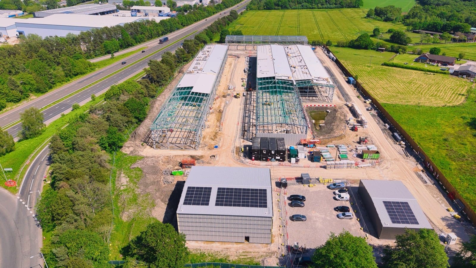 Principal contractor site with multiple work fronts — under CDM 2015 the PC plans, manages and monitors every lifting operation on it