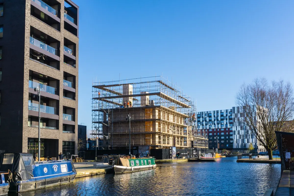 Tower crane operating above a UK residential development — comparison context for mobile vs tower crane selection