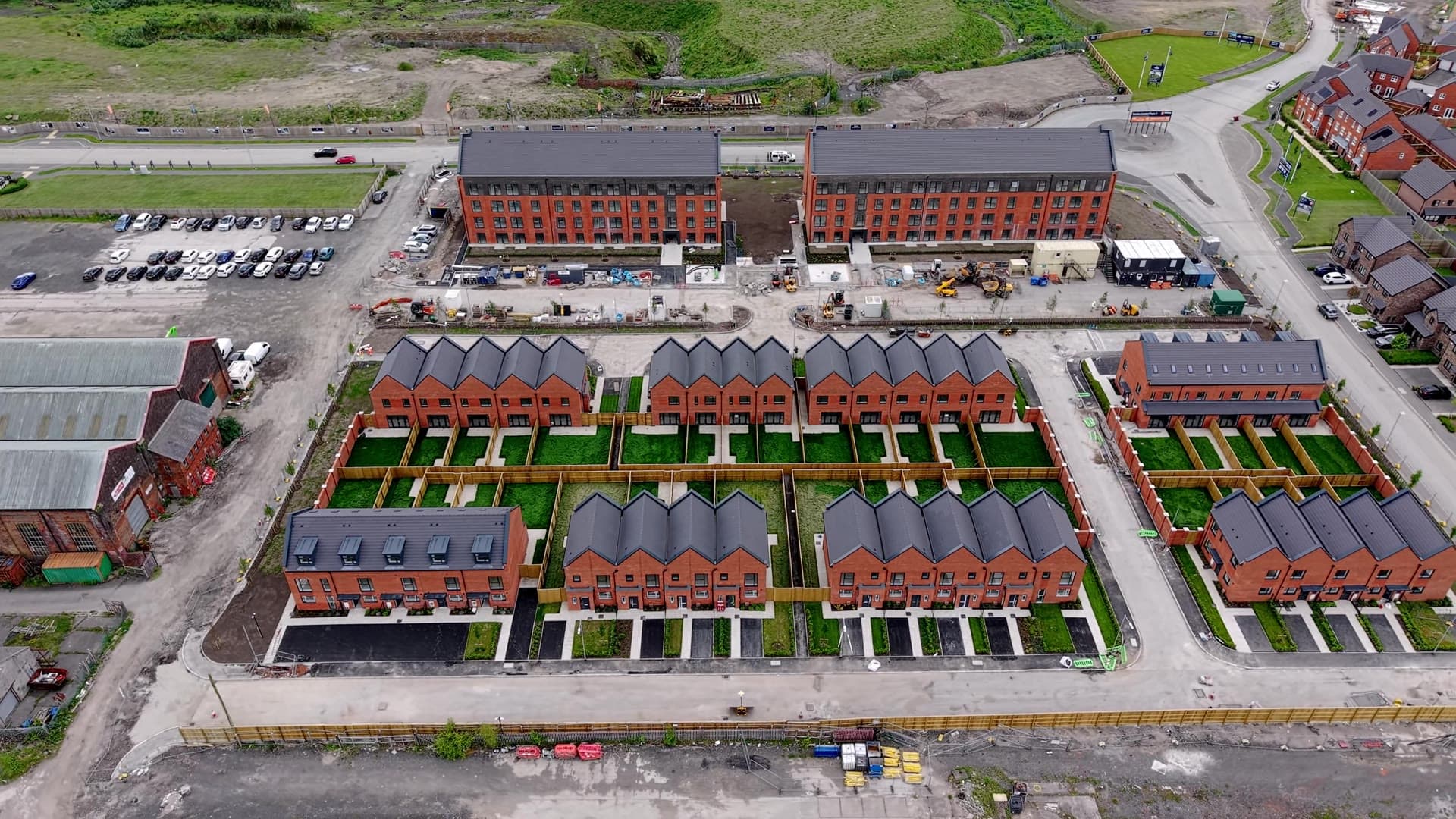 Aerial drone photograph of Caddick Construction's Rivington Chase development at the former Horwich Loco Works, Horwich — new affordable homes under construction