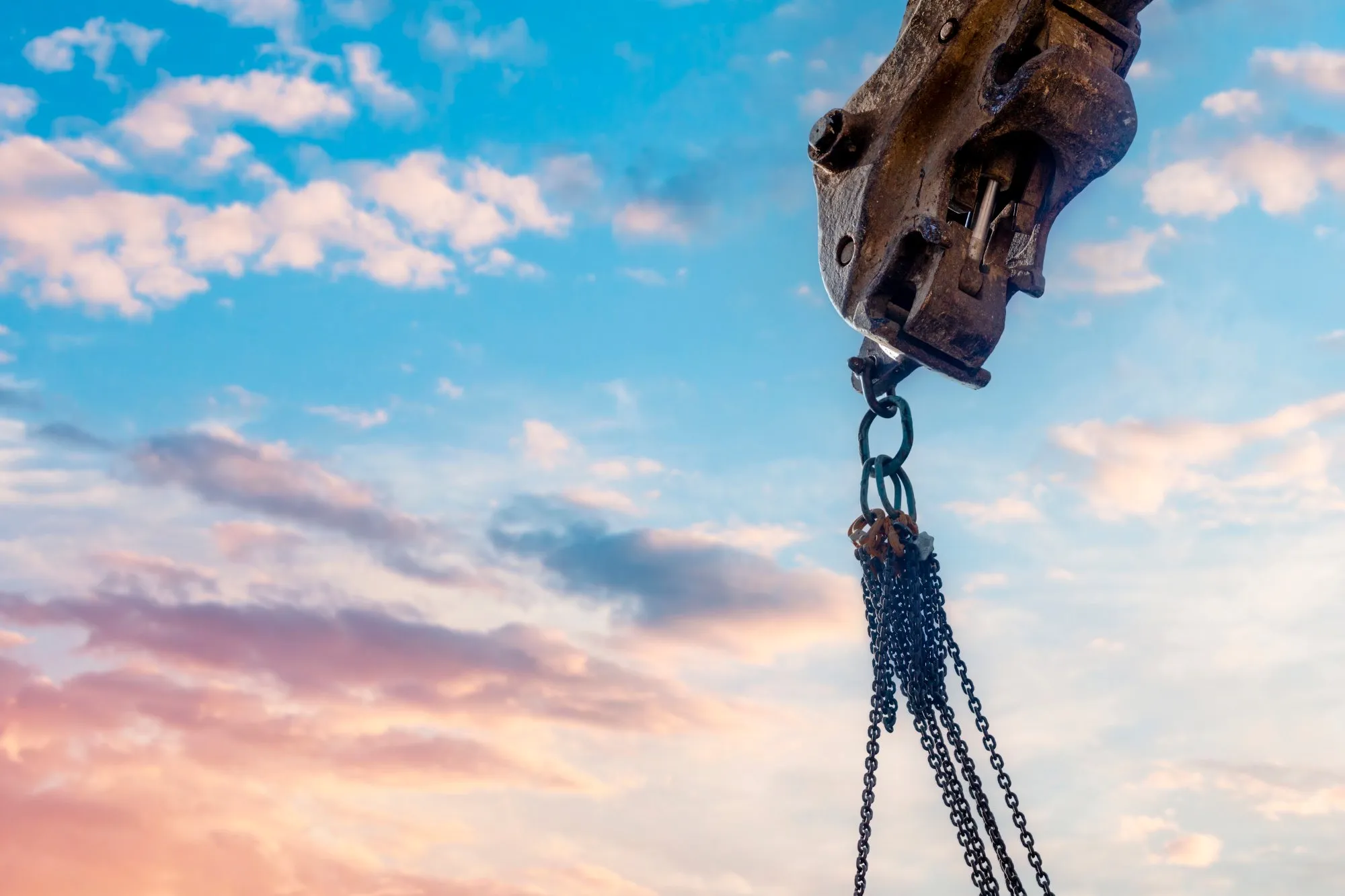 Excavator lifting hook with chain slings ready for lifting operation - Professional excavator lift plans UK