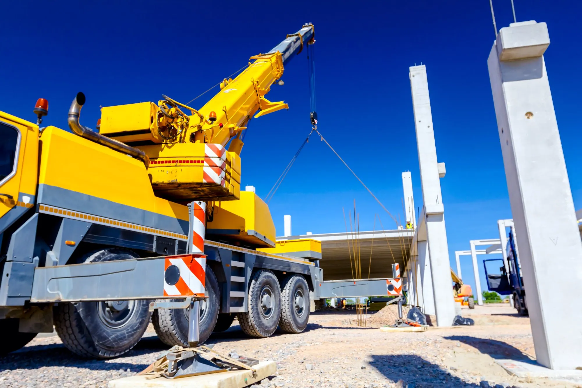 Mobile crane lifting a precast concrete unit on a UK construction site — a typical lifting operation covered by a lift plan